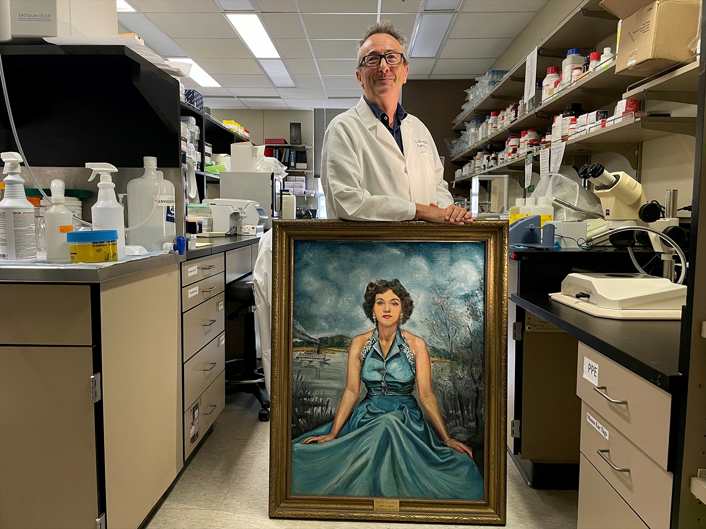 Steve Bassnett, PhD with portrait of Grace Nelson Lacy (painted in 1939)